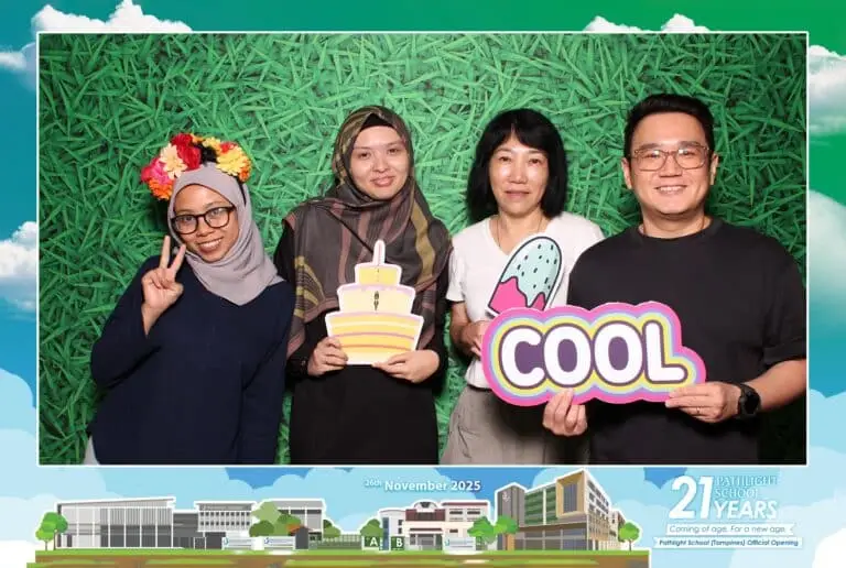 Guests posing at a magnet photo booth in Malaysia